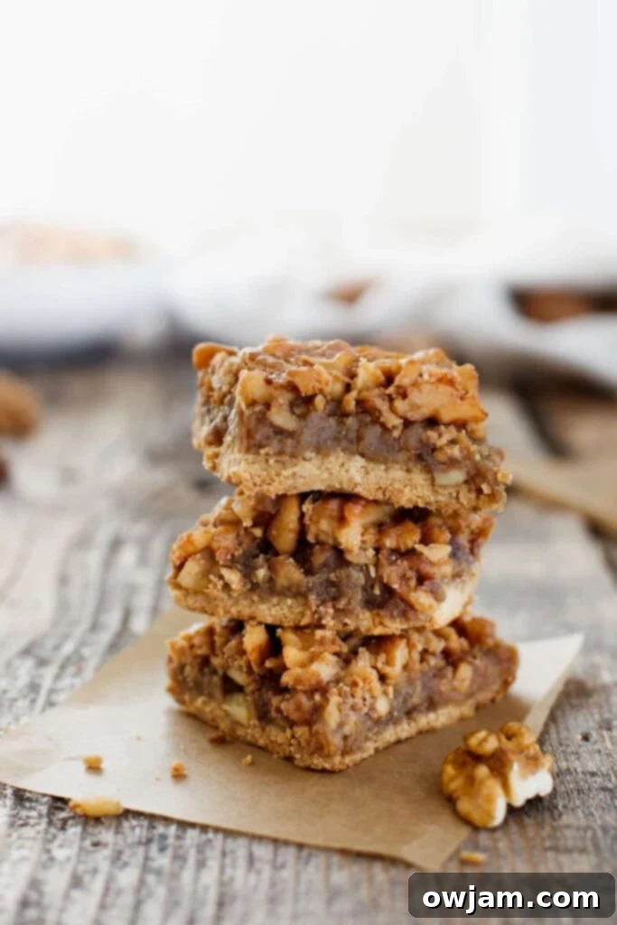 Gluten-free Maple Walnut Bars, featuring a rich, nutty topping over a dense base.