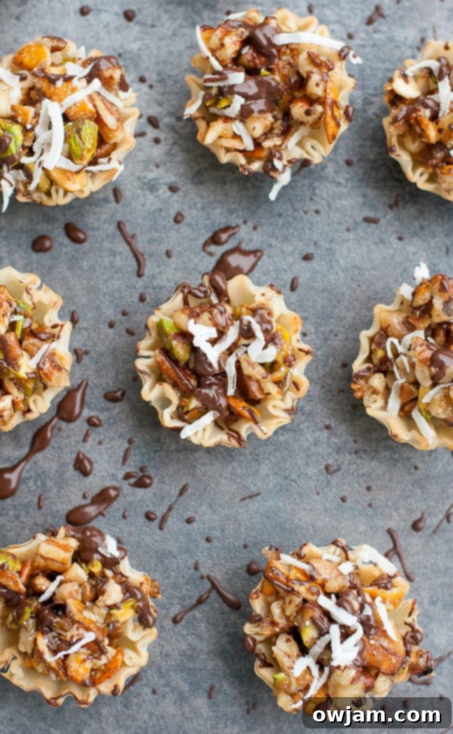 Close-up of decadent Chocolate Coconut No-Bake Baklava Bites, showcasing layers of phyllo, chocolate, coconut, and pistachios.