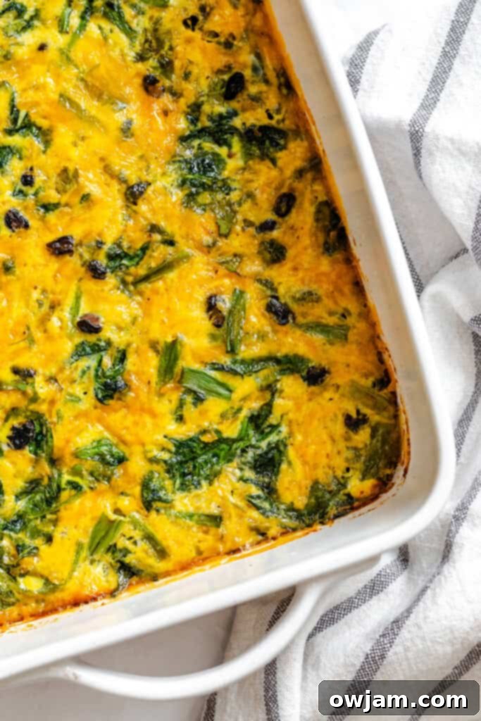 Cheesy Black Bean Egg Bake in a white dish, ready to serve