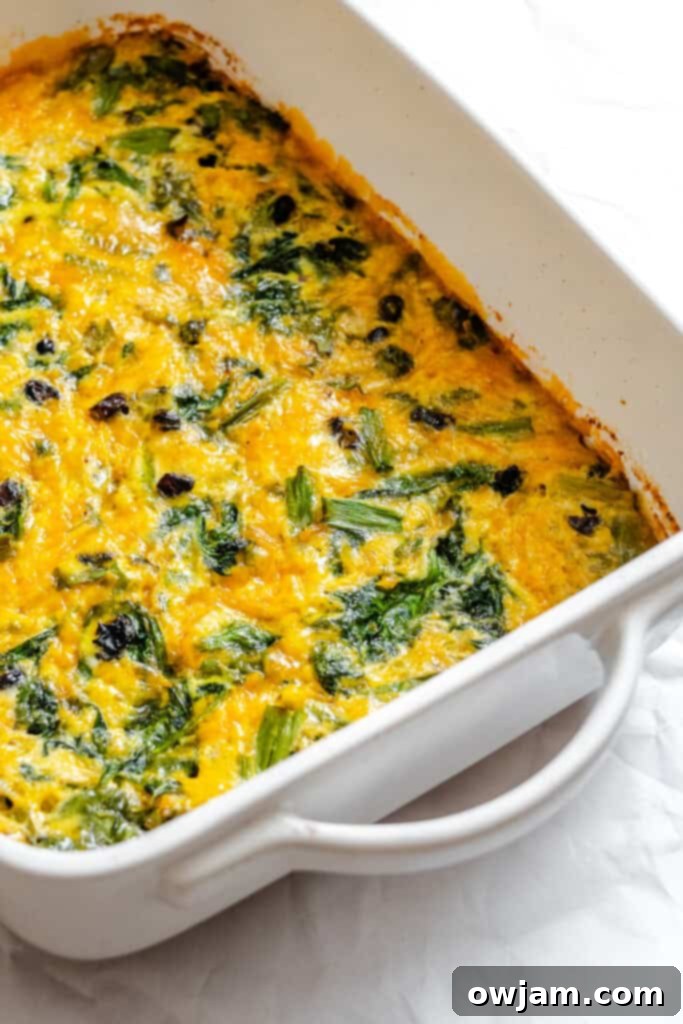 Cheesy Black Bean Egg Bake in a baking dish, cut into squares