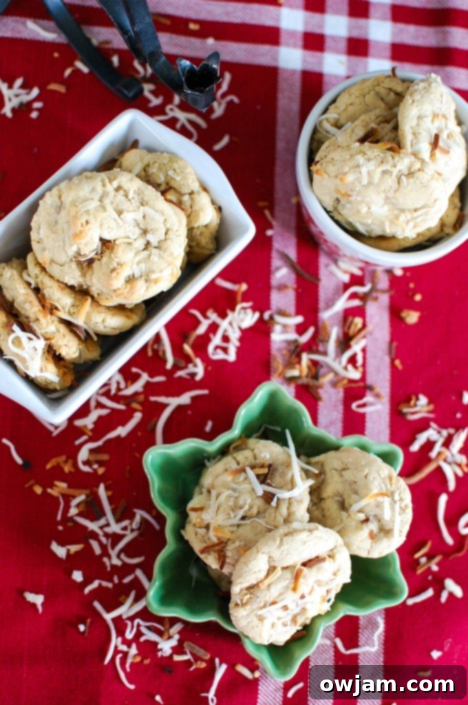 White Chocolate Toasted Coconut Cookies artfully arranged on a cooling rack, glistening and ready to be enjoyed.