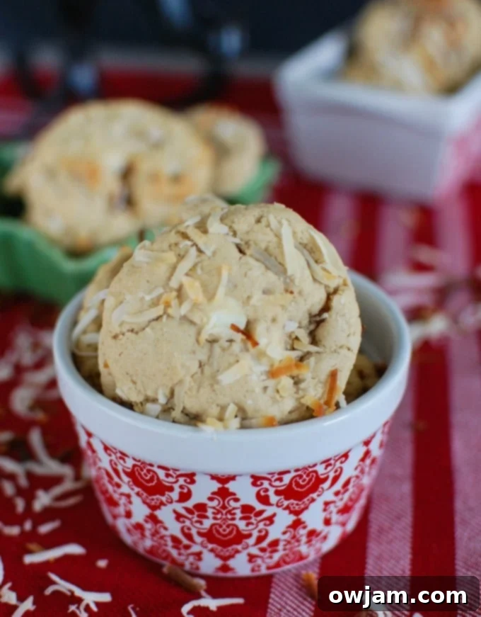 A generous pile of delicious White Chocolate Toasted Coconut Cookies, freshly baked and ready to share from A Cedar Spoon.