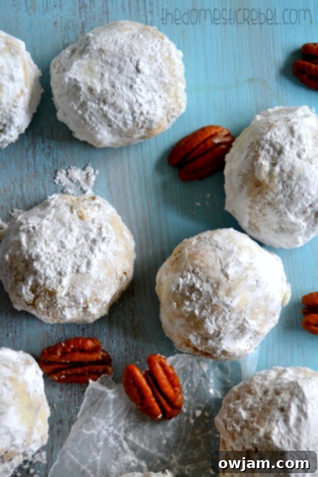 Melt-in-your-mouth Snowball Cookies, also known as Russian Tea Cakes, covered in powdered sugar.