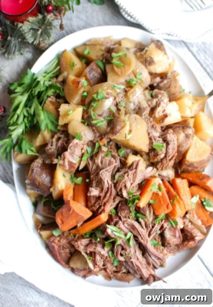 Tender Slow Cooker Chuck Roast 4 Crockpot Chuck Roast Recipe garnished with fresh parsley