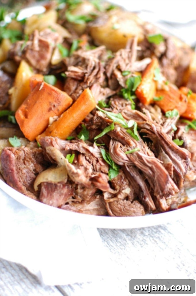 Tender Slow Cooker Chuck Roast 5 Crockpot Chuck Roast Recipe with carrots and potatoes served