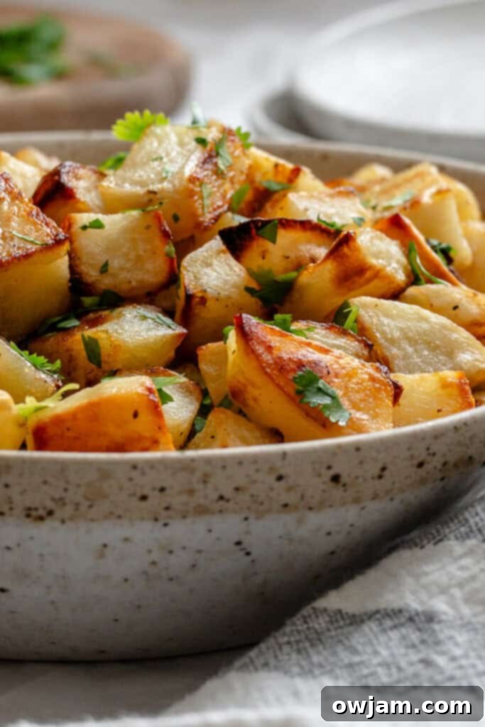 Lemon Cilantro Roasted Potatoes with cilantro in bowl