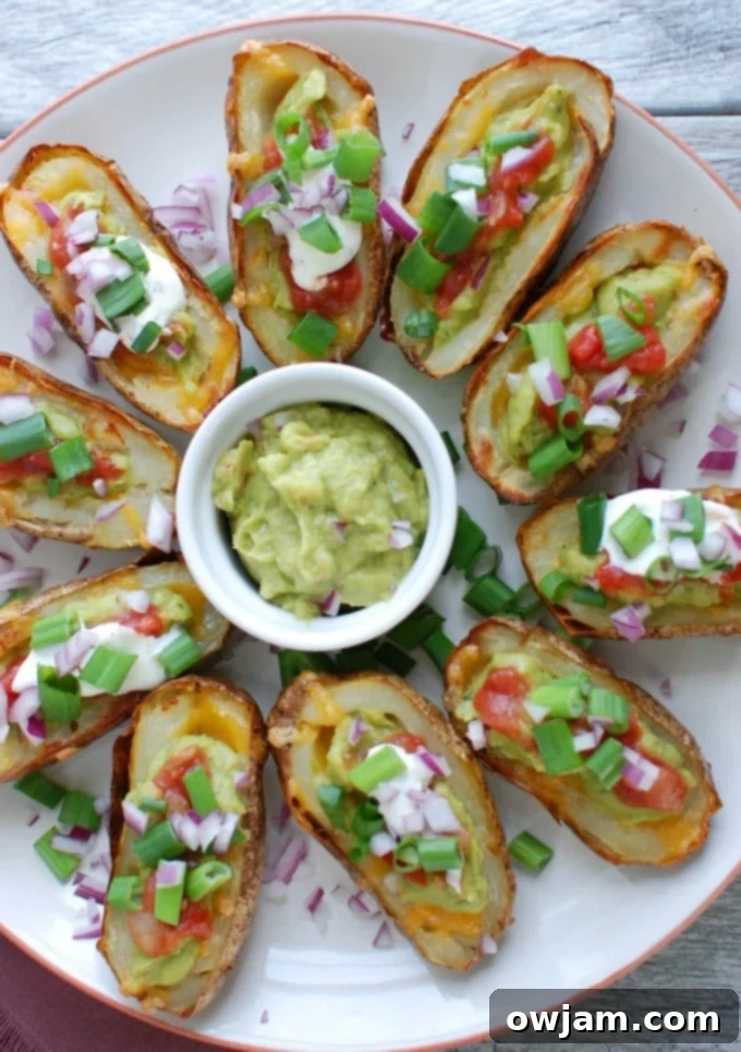 Loaded Guacamole Potato Skins 4 Another view of Guacamole Stuffed Potato Skins on a white platter, highlighting the fresh toppings