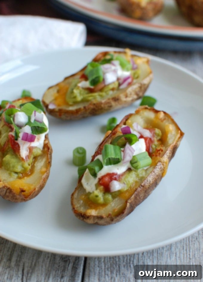 Loaded Guacamole Potato Skins 5 A tray of freshly baked potato skins, ready for topping with guacamole and other garnishes