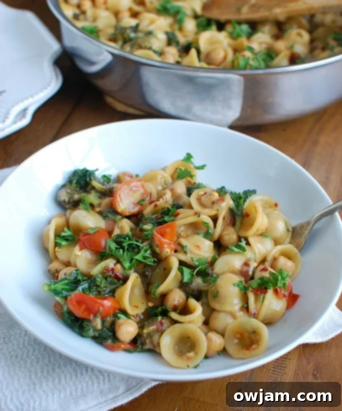 One-Pot Wonder Chickpea Kale Pasta 6 One Pot Chickpea Kale Pasta Recipe with spoon.