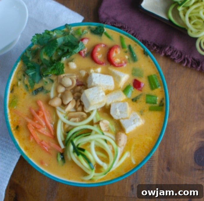 Creamy Coconut Zoodle Soup 3 Overhead shot of Thai Coconut Zoodle Soup in a teal bowl, showcasing fresh ingredients