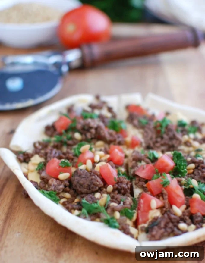 Spiced Beef Hummus Pita Pizza 2 Spiced Beef and Hummus Pita Pizza on cutting board