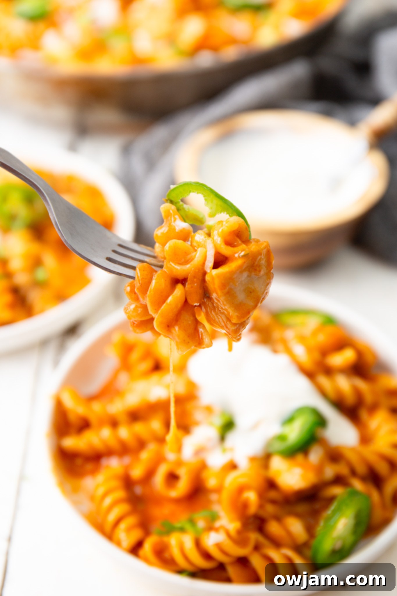 Creamy One-Pot Chicken Enchilada Pasta 4 One Pot Chicken Enchilada Pasta on a fork