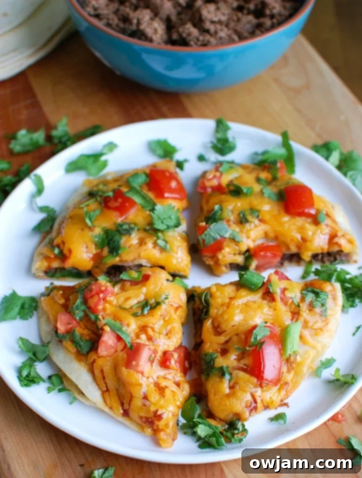 Fiesta Flatbread 2 A vibrant and delicious Mexican Pizza, adorned with fresh toppings and melted cheese, ready for a family dinner.