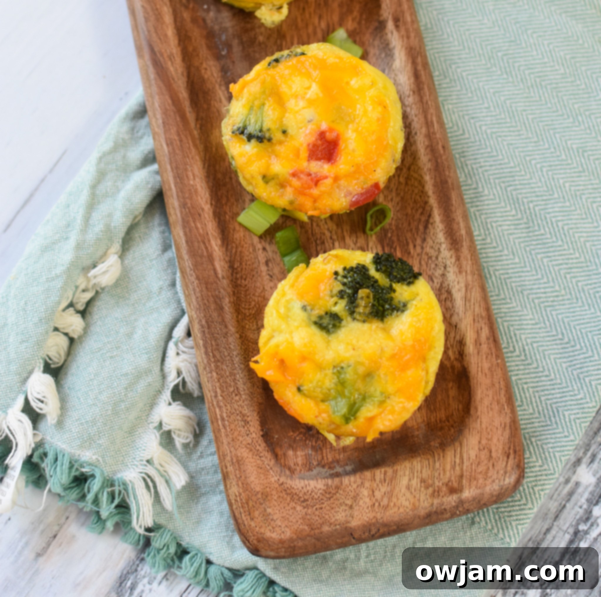 Broccoli Cheddar Cups on a cutting board, ready to be served or packed.