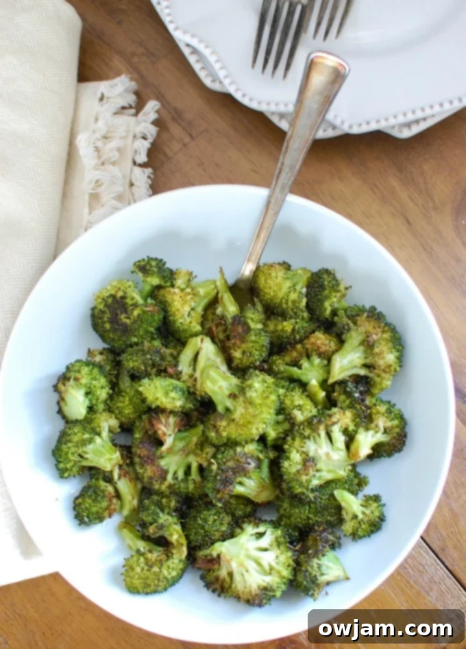 Roasted Broccoli Perfection 5 Roasted Broccoli with a fork.