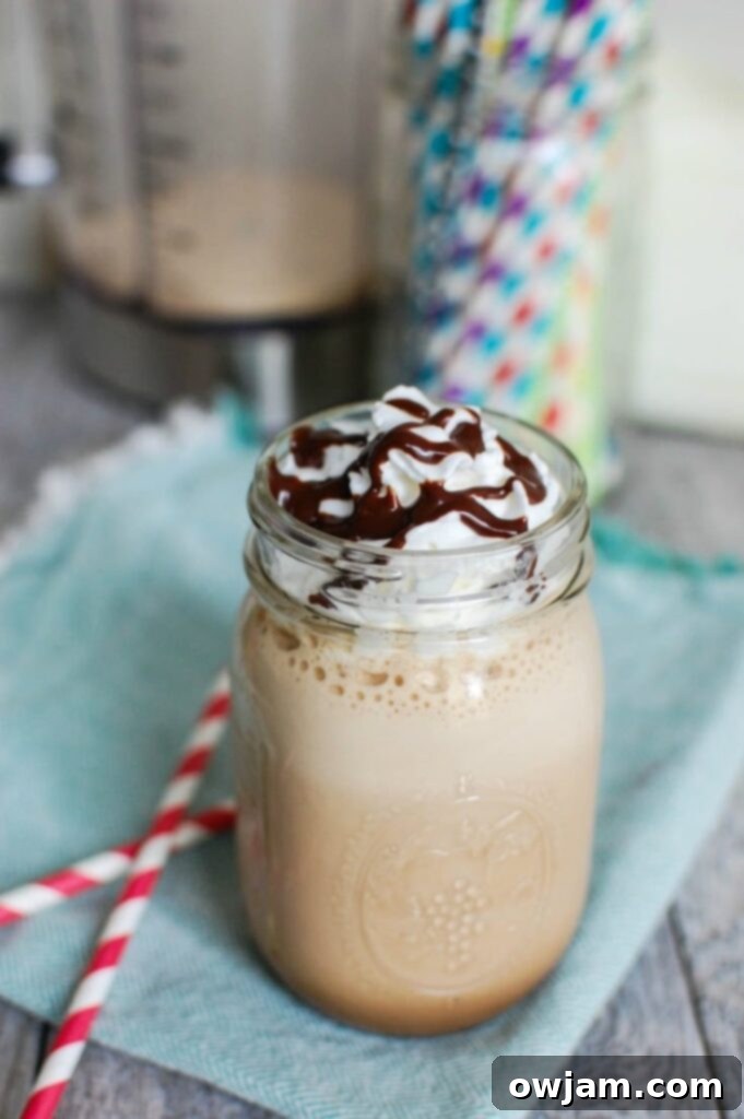 Blender filled with ingredients for a Homemade Mocha Frappuccino before blending.