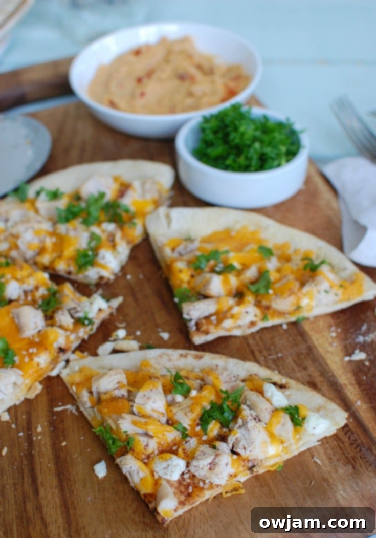 Chicken Feta Cheddar Pita Pizzazz 3 Close-up of Chicken Feta Cheddar Pita Pitza with generous fresh parsley.