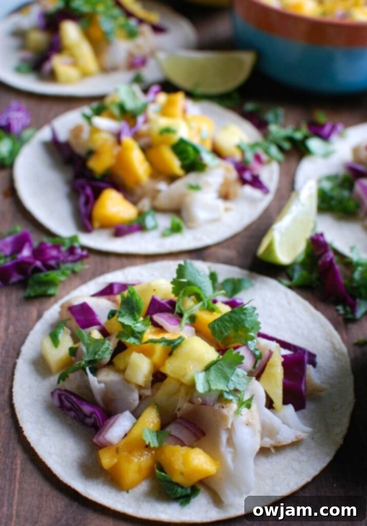 Grilled Fish Tacos: A Tropical Salsa Sensation 2 Grilled Fish Tacos with Tropical Salsa on cutting board