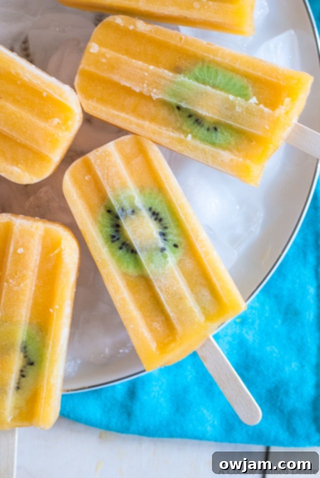 25 Icy Delights to Beat the Summer Heat 19 kiwi-mango-lemonade-popsicles