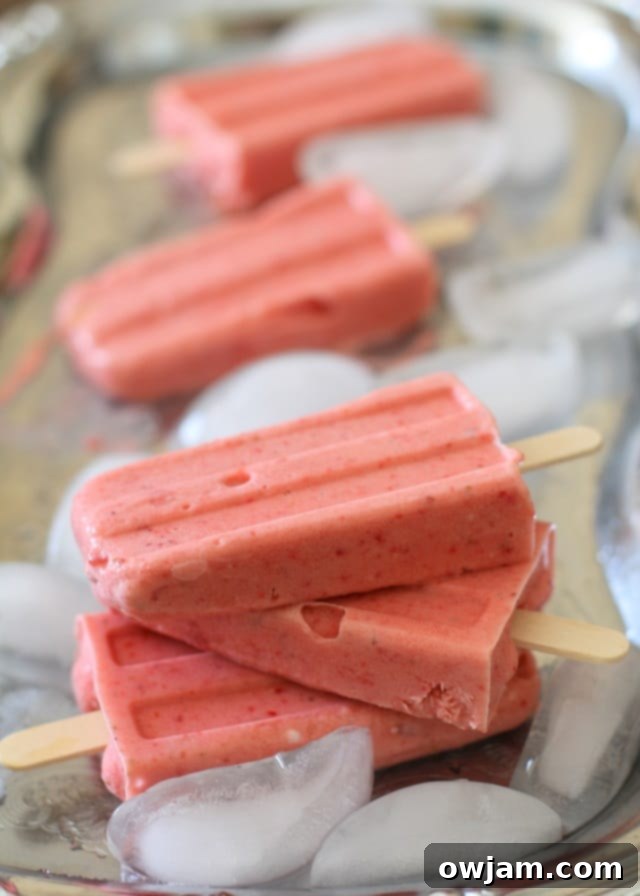 25 Icy Delights to Beat the Summer Heat 23 strawberry_coconut_milk_popsicles_hero