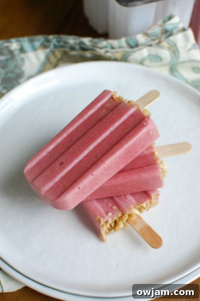 Refreshing homemade Strawberry Banana Yogurt Popsicles, a healthy summer treat made with fresh fruit and Greek yogurt.