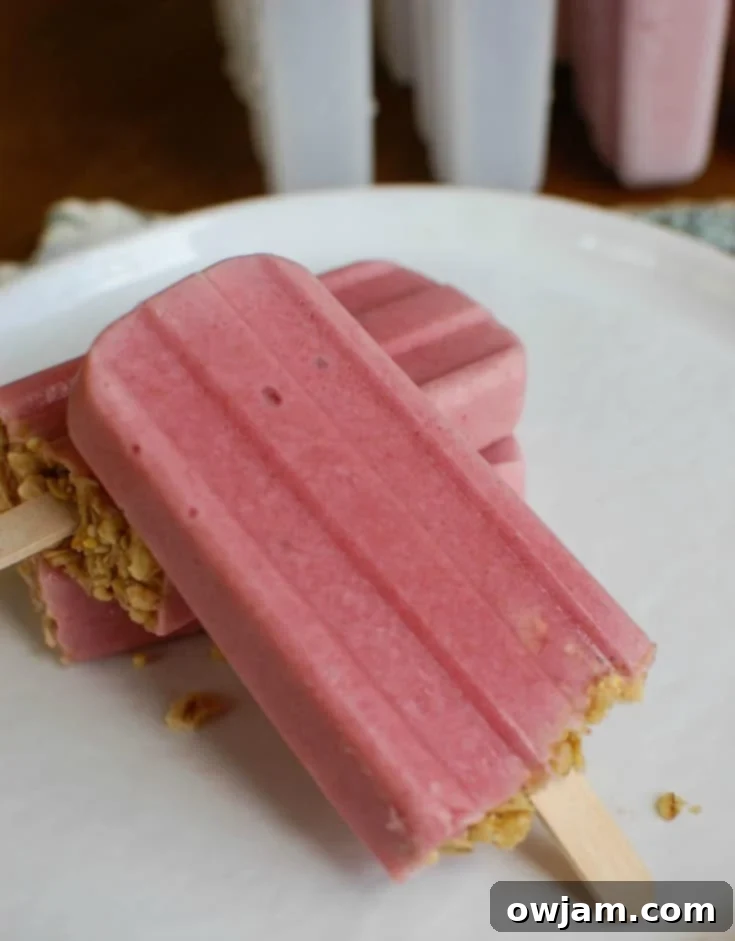 Homemade Strawberry Banana Yogurt Popsicles, an easy and healthy dessert perfect for summer days.