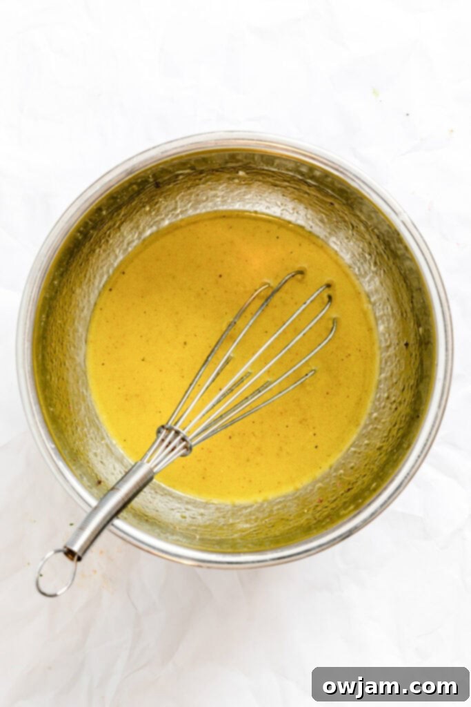 Fattoush Salad dressing mixed in a small bowl, ready to be poured