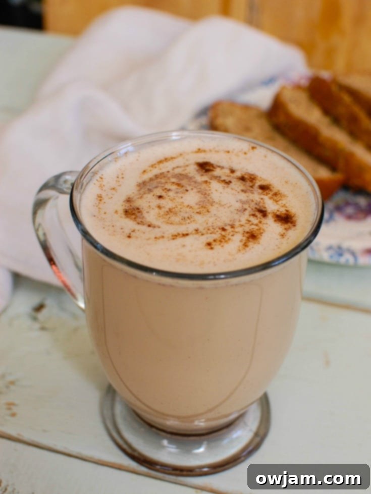 Cozy Spiced Chai Latte 6 Close-up of Homemade Chai Tea Latte with a cinnamon sprinkle.