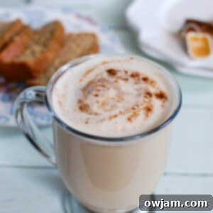Cozy Spiced Chai Latte 7 Chai Tea Latte in a clear mug, garnished with cinnamon, representing the Homemade Chai Tea Latte recipe.
