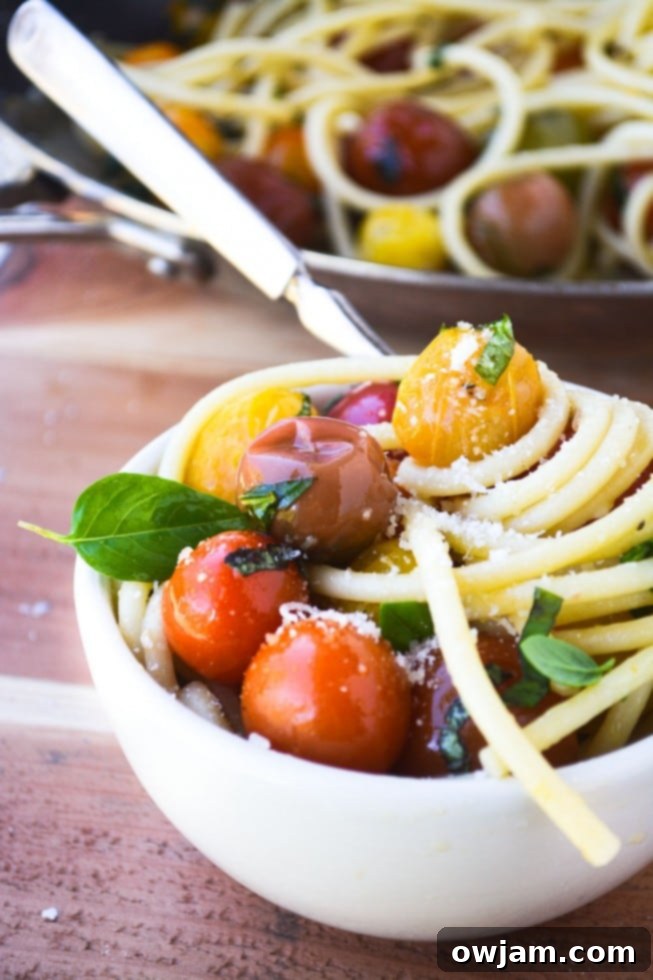 Bucatini with Burst Tomatoes in a large serving bowl.
