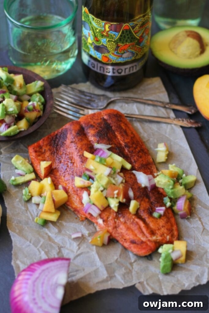 Flaky Smoky Broiled Sockeye Salmon served with a colorful Peach-Avocado Salsa.