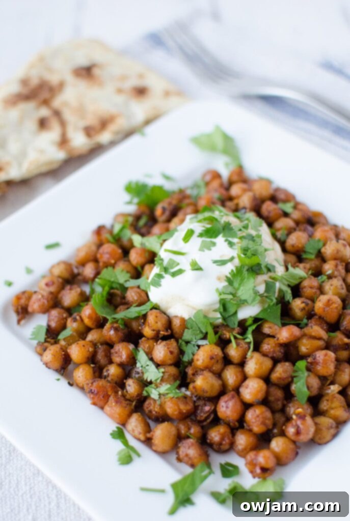 A bowl of Quick Indian Chickpeas, spiced and garnished.