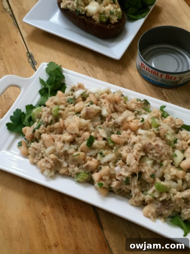 Italian Style Tuna Salad served with crusty bread and fresh basil.