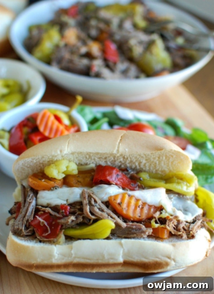 Ultimate Slow Cooker Italian Beef Sandwiches 2 Slow Cooker Italian Beef Sandwiches make a great game day food or weeknight dinner that easily cooks in your crockpot. Chuck roast is slowly cooked in Italian seasonings, beef broth and mixed with pepperoncini peppers and Giardiniera. Toast the beef in a hoagie bun with provolone cheese and extra pepperoncini and Giardiniera for the perfect sandwich.