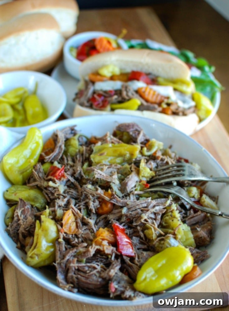 Ultimate Slow Cooker Italian Beef Sandwiches 3 Slow Cooker Italian Beef Sandwiches make a great game day food or weeknight dinner that easily cooks in your crockpot. Chuck roast is slowly cooked in Italian seasonings, beef broth and mixed with pepperoncini peppers and Giardiniera. Toast the beef in a hoagie bun with provolone cheese and extra pepperoncini and Giardiniera for the perfect sandwich.