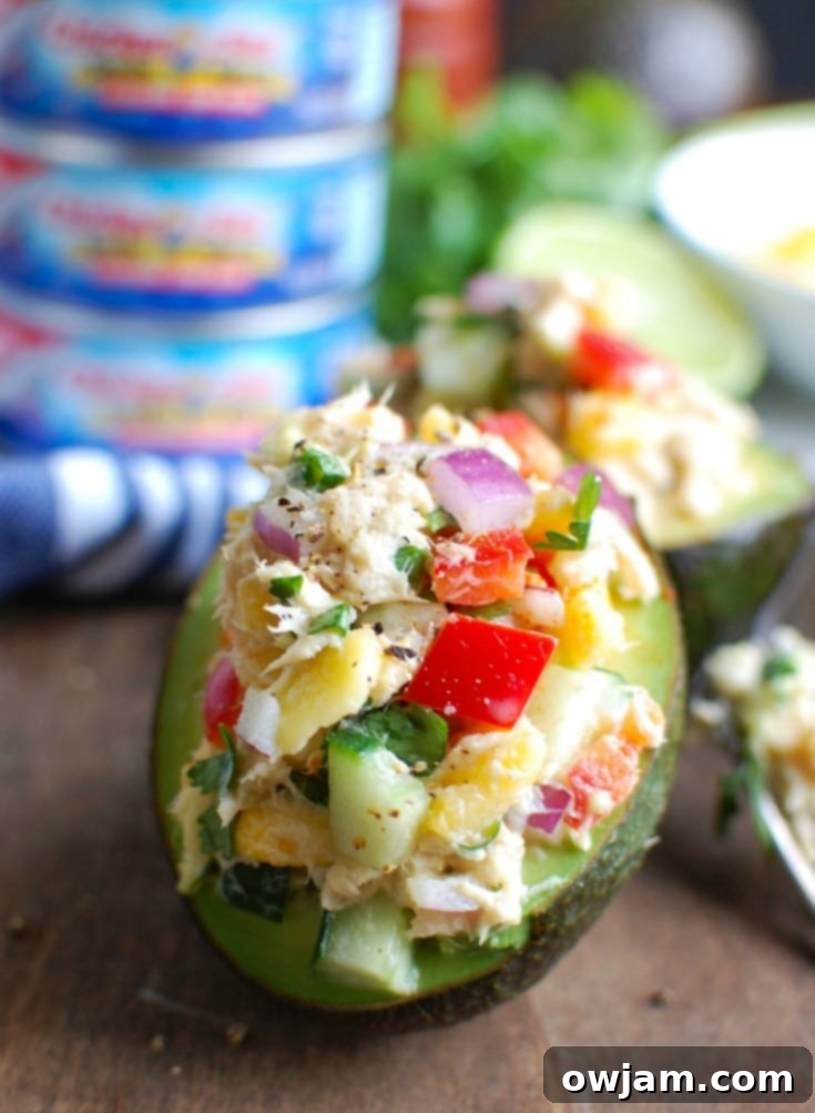 Tropical Tuna Avocado Boats 4 Tropical Tuna Stuffed Avocado is the perfect, quick and healthy lunch at your desk or on-the-go. Fresh mango, cilantro, fresh vegetables and lime juice is mixed with Sold White Albacore Tuna and Greek Yogurt and then stuffed in a delicious avocado.