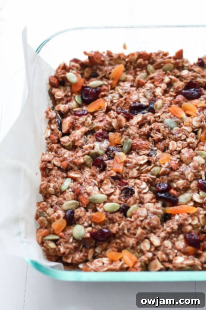 No Bake Pumpkin Spice Granola Bars with a drizzle of white chocolate.
