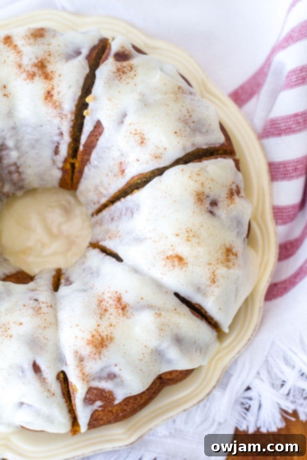 Cream Cheese Glazed Pumpkin Bundt Cake on a serving plate.
