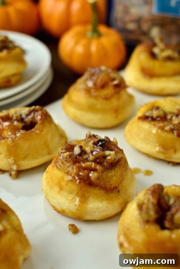 Mini Pumpkin Sticky Buns glistening with glaze.