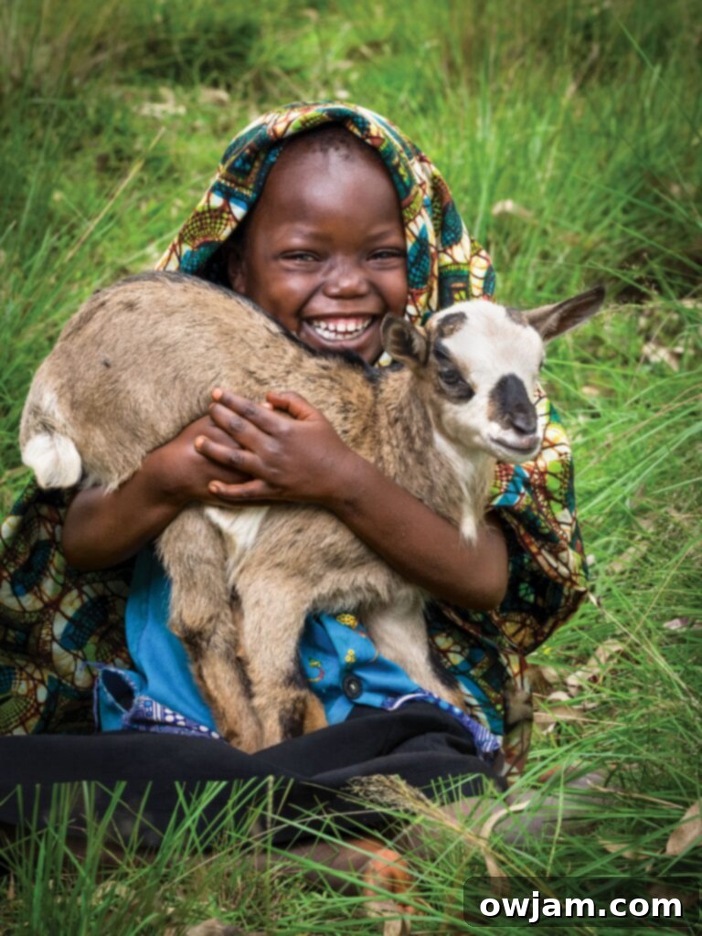 Gasorwe, Burundi. Gift Catalog: Chanian Niyonyishu, girl child, 5-years-old, pictured with a baby goat. Quote from mother, Zuena Mukeshimana: "With the goat we received, we can now fertilize our ground for better food production."