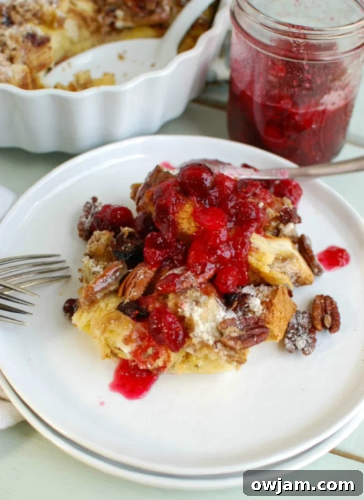 Overnight Eggnog French Toast Bake with Cranberry Maple Syrup is a delightful holiday breakfast, perfect for a festive morning.