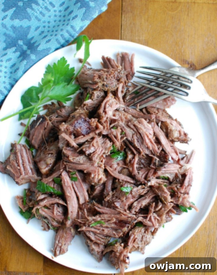 Effortlessly Elegant Red Wine Slow Cooker Ribs 4 Overhead shot of Slow Cooker Red Wine Short Ribs, highlighting the rich sauce and tender meat.
