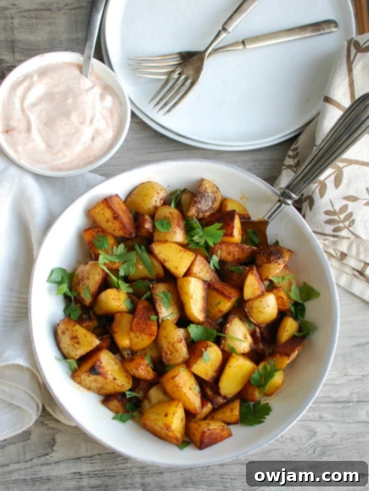 Your favorite potatoes are tossed in olive oil and smoked paprika and roasted until they are soft on the inside and crispy on the outside paired with a creamy yogurt dipping sauce. These Paprika Roasted Potatoes with Spiced Yogurt Sauce make the perfect side dish to any meal.