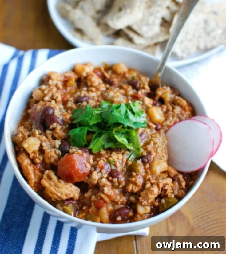 Slow Cooker Turkey Quinoa Chili is hearty, healthy and cooks all day in your crockpot! You can come home to a warm, comforting bowl of chili without spending time in the kitchen. This is perfect for dinner or watching football