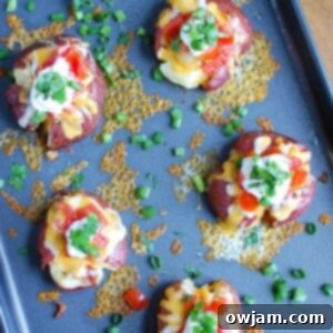 Crispy Loaded Smashed Spuds 10 Loaded Smashed Potatoes are crispy on the outside and soft on the inside and loaded with cheese, sour cream, tomatoes, green onion and cilantro. These make an easy family meal or appetizer for game day or a party!