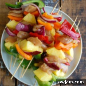 Paradise Chicken Skewers 5 Hawaiian Chicken Kabobs on a white plate