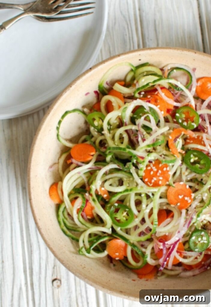 Zesty Asian Cucumber Noodle Salad 3 Asian Cucumber Noodle Salad is a light and healthy salad or side dish. Cucumber and red onion noodles, carrots and jalapeños are tossed with a light Asian dressing.