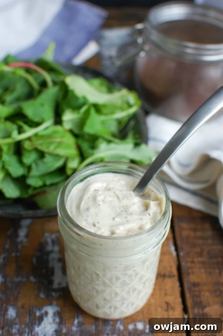 Velvety Tahini Yogurt Dressing 3 Tahini Yogurt Dressing with spoon