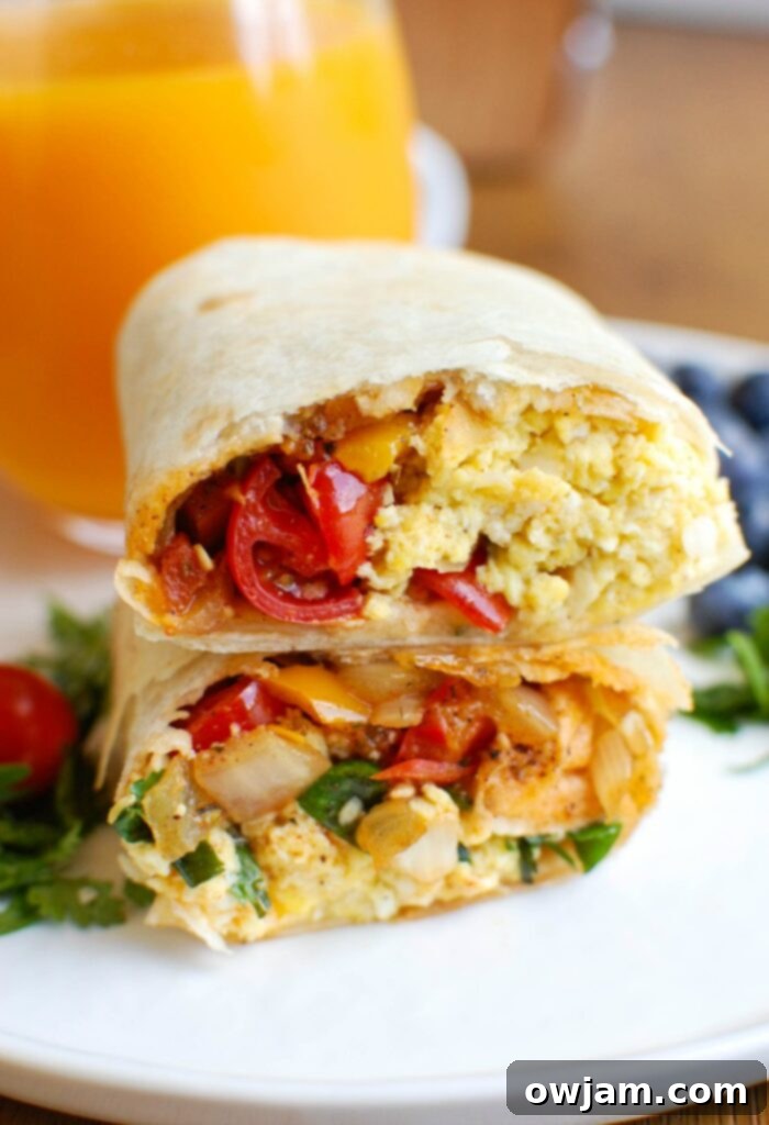 Close-up of a neatly wrapped Vegetarian Breakfast Egg Burrito, ready to eat.