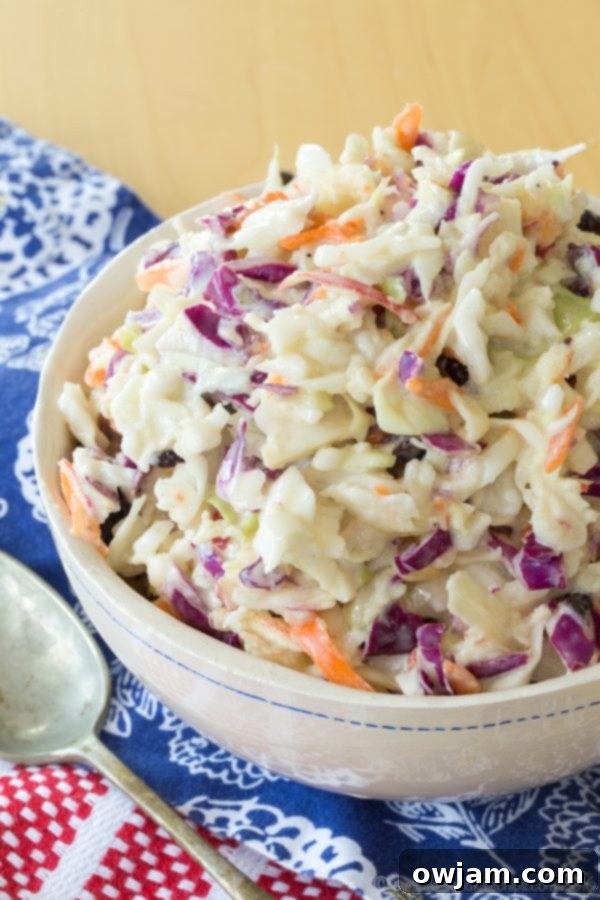 Maple Dijon Apple Cole Slaw, a sweet and tangy crunchy salad.